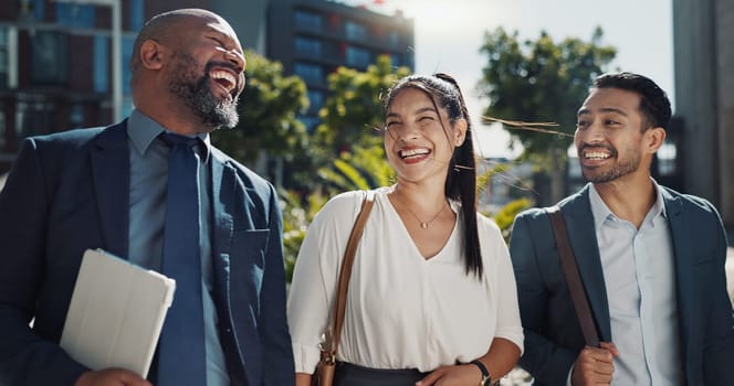 Business people, walking and travel in city with talking on morning commute, partnership and happy. Employees, men and woman with conversation, collaboration and networking outdoor in urban town.