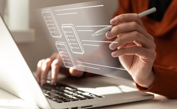 Paperless workplace idea, e-signing, electronic signature, document management. A businessman signs an electronic document on a digital document on a virtual notebook screen using a stylus pen.