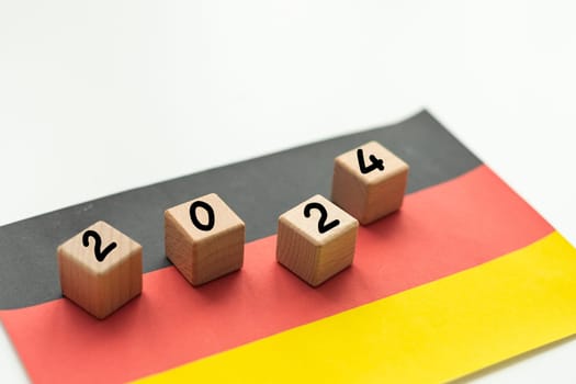 2024, Germany, Germany flag with date block, Concept, Important events for Germany in the new year, election, economy, social activities, central bank, Germany foreign policy. High quality photo