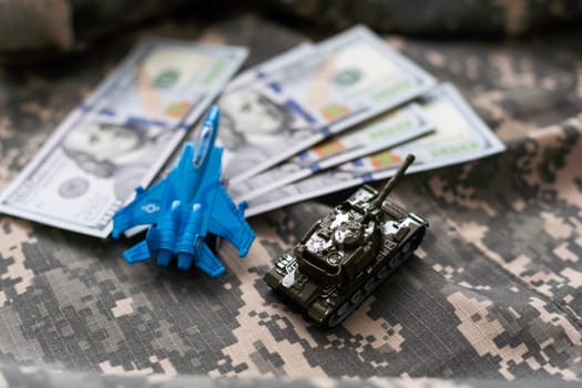 Toy tank with camouflage color . Military vehicles toy. Simple cheap toys for children , warfare, warzone vehicles, kids playing war, abstract concept nobody. High quality photo