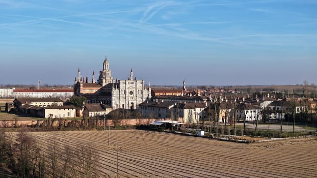 Aerial shot of Certosa di Pavia cathedral a historical monumental complex that includes a monastery and a sanctuary. Pavia ,Italy.