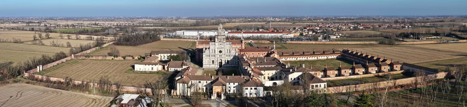 Aerial shot of Certosa di Pavia cathedral a historical monumental complex that includes a monastery and a sanctuary. Pavia ,Italy.