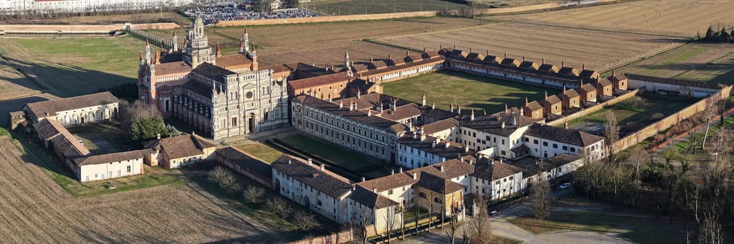 Aerial shot of Certosa di Pavia cathedral a historical monumental complex that includes a monastery and a sanctuary. Pavia ,Italy.