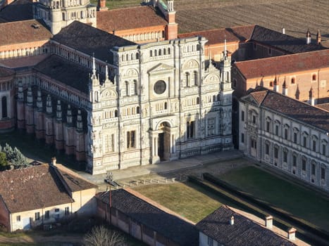 Aerial shot of Certosa di Pavia cathedral a historical monumental complex that includes a monastery and a sanctuary. Pavia ,Italy.