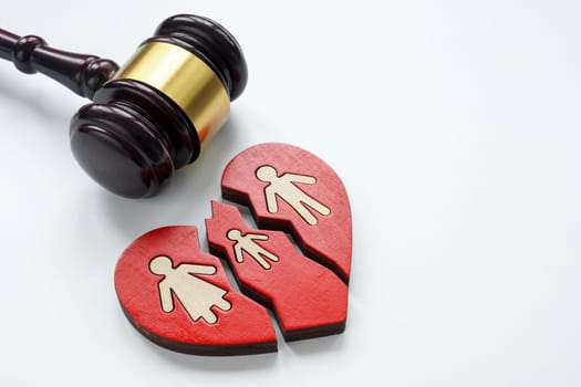 A broken heart and gavel as a symbol of divorce, alimony and custody.