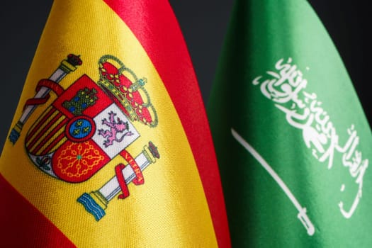 Close up of the flags of Spain and Saudi Arabia.