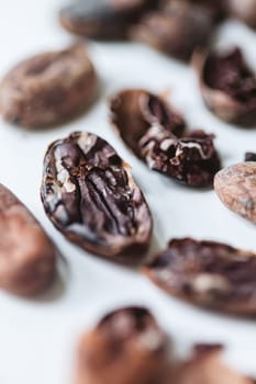 Closeup cocoa roasted beans. Shallow dof.