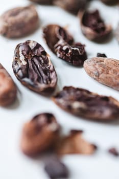 Closeup cocoa roasted beans. Shallow dof.