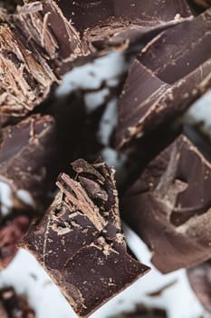 Cocoa beans with chocolate on a white background. Shalllow dof. Top view