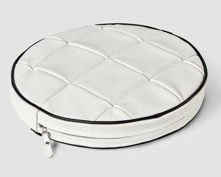 Patchwork white leather round floor cushion with contrasting black piping and hidden zipper, showcasing elegance and contemporary design of items of interior furnishings