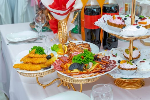 The banquet table is served with meat and fish products.