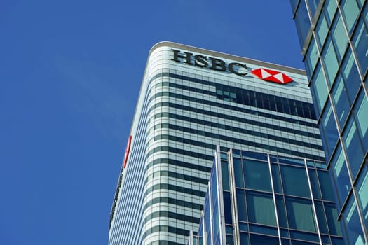 London, United Kingdom - February 03, 2019: Sun shines on world Headquarters of HSBC Holdings plc at 8 Canada Square, Canary Wharf. It's 7th largest bank worldwide and was established in 1865
