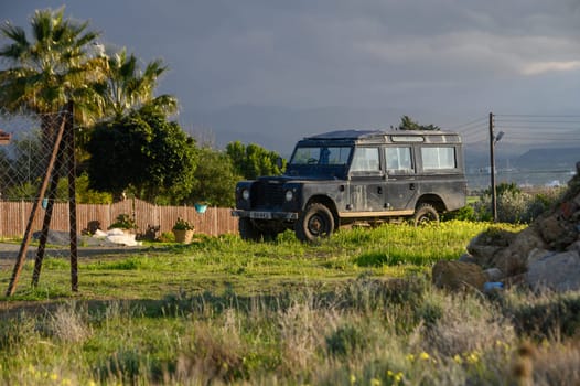 Gaziveren/Cyprus-05.02.2024: old SUV near a house in the village 1