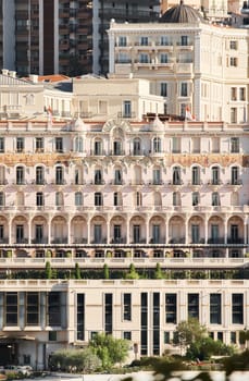 Monaco, Monte Carlo, 27 September 2022: The facade of famous Hotel Hermitage at sunny day, building of yellow color, balcony, bas-relief. High quality photo