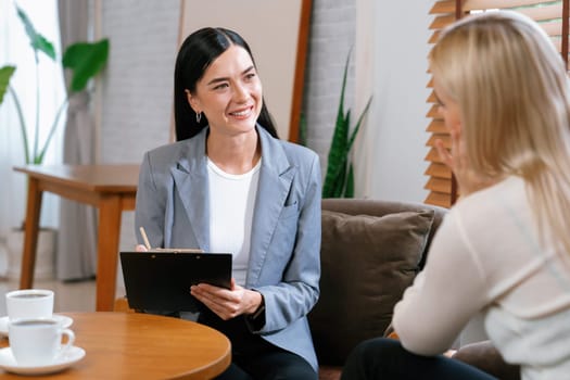 Psychological consultation gaining improvement on mental problem, happy young female patient getting better during therapy session while psychiatrist making diagnostic on mental illness. Blithe