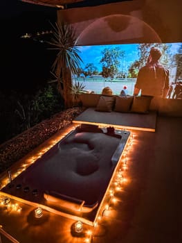 Night jacuzzi bathtub with movie projection in Doi Chang in Chiang Rai, Thailand, south east asia