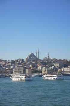 Turkey istanbul 19 june 2023. ferryboats parked in the waters of the Bosphorus river nearby the Eminonu Mosque,