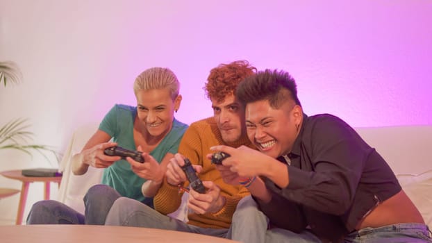 Group of happy and excited friends playing console at home
