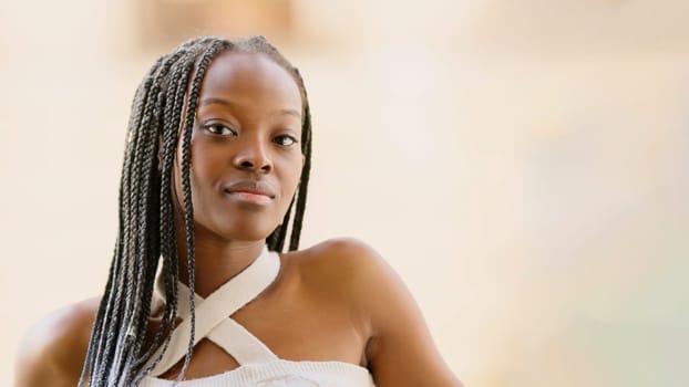 Confident young black woman looking at camera, with copy space