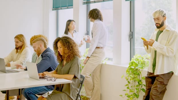 Photo of diverse people working in a modern coworking space