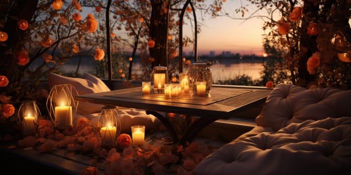 Beautiful view of garden furniture with pillow and burning candles at balcony for romantic dinner.