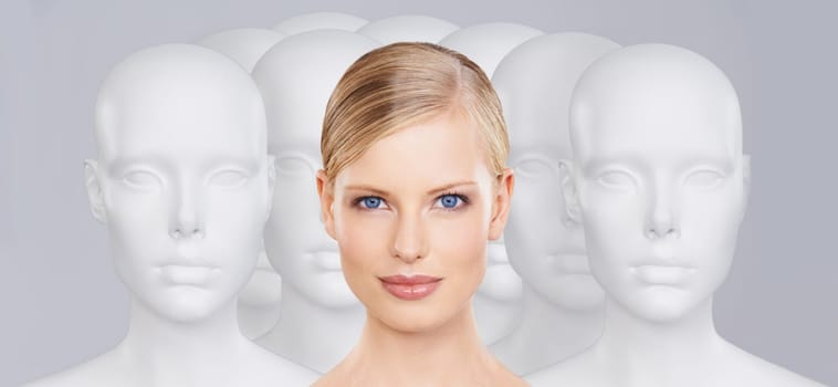 Woman, mannequins and portrait for identity, beauty and individuality on studio background. Person, skincare and dummy with face for creativity and cosmetics or unique ideas for satisfaction and skin.