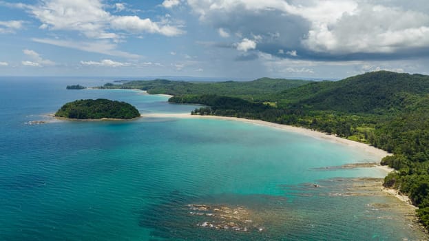 Aerial drone of tropical landscape with sandy beach and island. Kelambu Beach. Borneo, Malaysia.