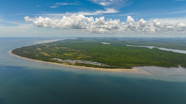 Aerial view of from the sea on the coast of the island of Borneo with tropical vegetation. Sabah, Malaysia.