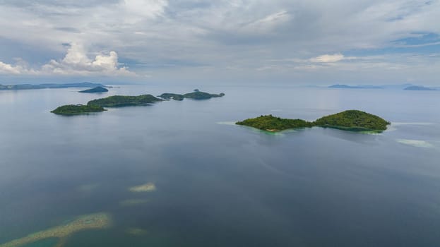 Aerial view of tropical islands with lagoons. Seascape in the tropics. Borneo, Sabah, Malaysia.