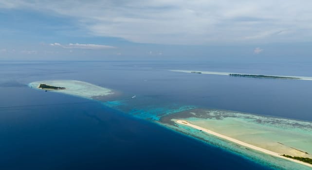 Top view of tropical islands on the atoll and coral reef. Timba Timba islet. Tun Sakaran Marine Park. Borneo, Sabah, Malaysia.