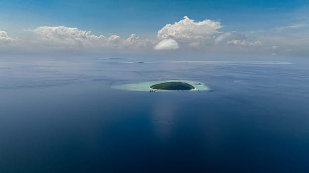 Tropical island Pompong with beach and blue sea. Tun Sakaran Marine Park. Borneo, Sabah, Malaysia.