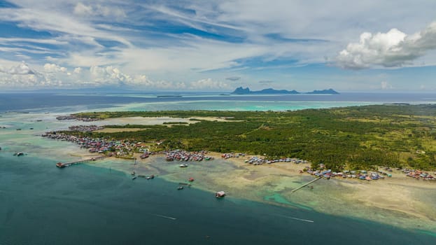 Aerial drone of island Bum Bum with towns and villages. Semporna, Sabah, Malaysia.