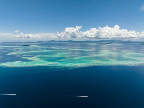 Aerial drone of beautiful tropical islands and atolls in turquoise water. Tun Sakaran Marine Park. Borneo, Sabah, Malaysia.