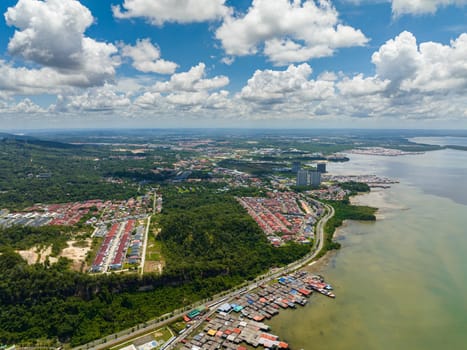 Aerial drone of city of Sandakan on the seashore on the island of Borneo, Malaysia.