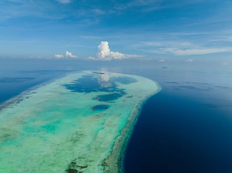 Aerial view of tropical atoll and coral reef. Seascape with tropical island.Tun Sakaran Marine Park. Borneo, Sabah, Malaysia.