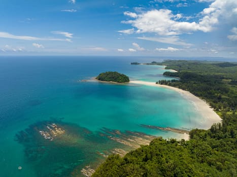 Aerial view of tropical landscape with sandy beach and island. Kelambu Beach. Borneo, Malaysia.