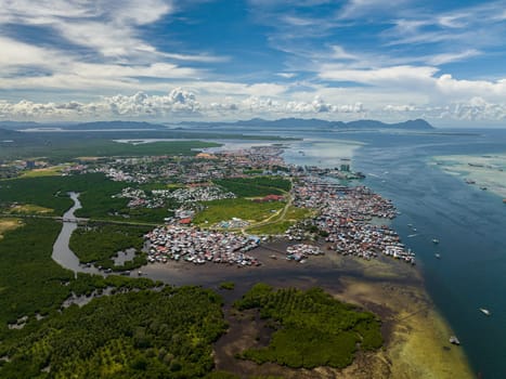 Aerial view of panorama of the city of Semporna with residential buildings. Borneo, Sabah, Malaysia.