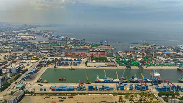Aerial drone of container terminal with cargo ships. Tanjung Priok sea port.