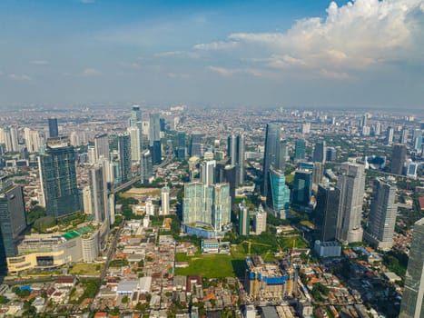 Cityscape with highway and skyscrapers in Jakarta.