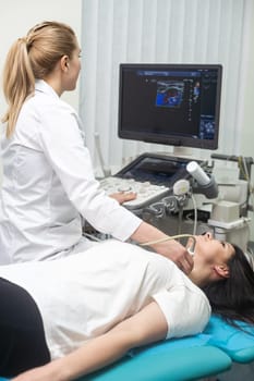 Ultrasound scanner in the hands of a doctor. Diagnostics. Sonography