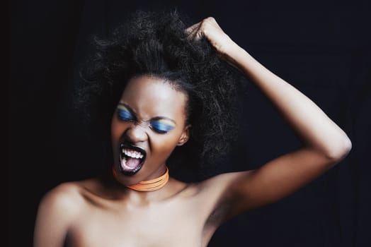 Beauty, hair and frustrated black woman on dark background for hairstyle, texture and natural afro. Haircare, salon crisis and angry African person with cosmetics, accessories and makeup in studio.