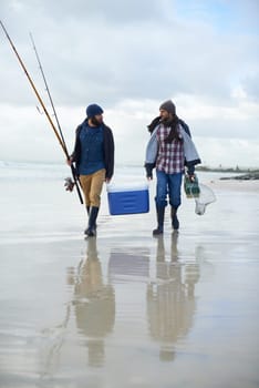 Fisherman, friends and walking on beach for fishing in the morning by sea with happiness, equipment or sky. Friendship, men and net with bonding, travel or rod by water for hobby, holiday or activity.