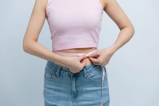 cropped shot of woman measuring her waist isolated on white