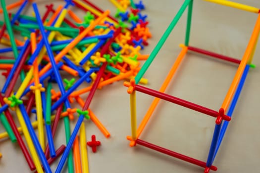 Cubic form made with straws from construction set for kids, flexible construction set with special connections