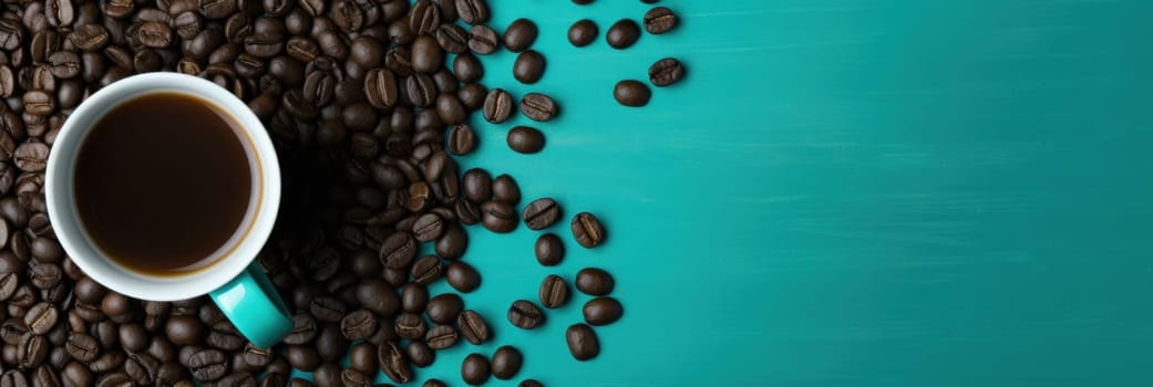A cup of coffee is surrounded by beans on a turquoise background