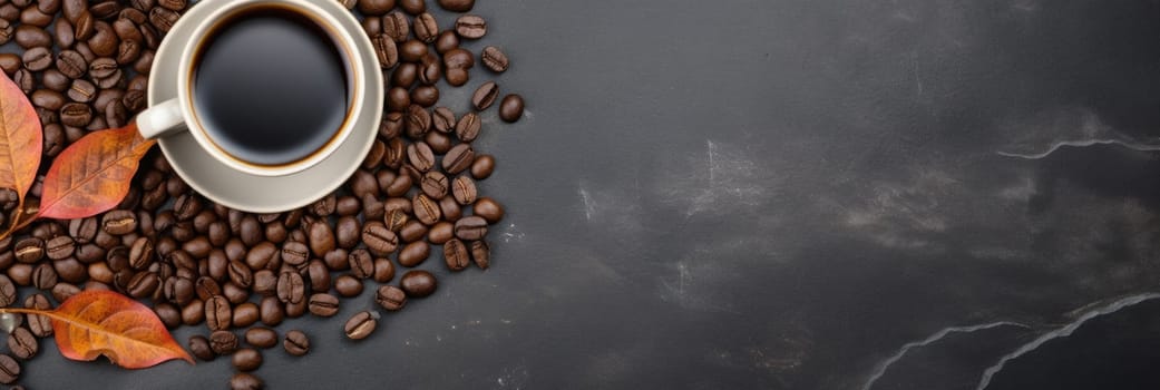 A cup of coffee is surrounded by beans and leaves
