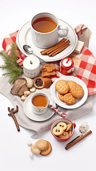A table topped with plates of cookies and cups of tea