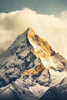 A snow covered mountain with clouds in the background