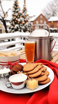 A plate of cookies and a cup of tea on a table