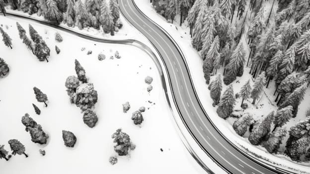 A black and white photo of a snow covered road